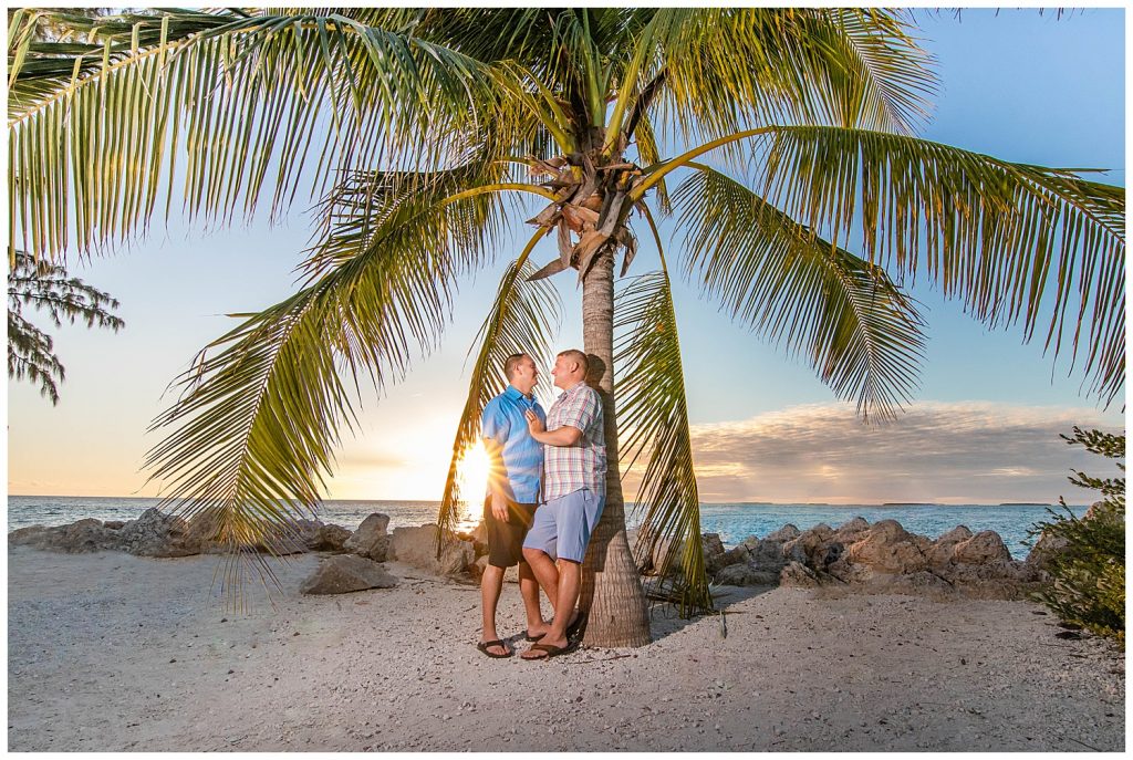 couple in front of palm tree