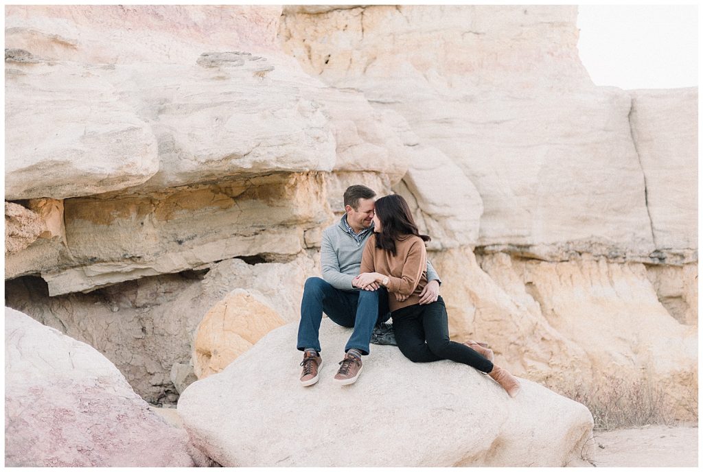 couple sitting on rock