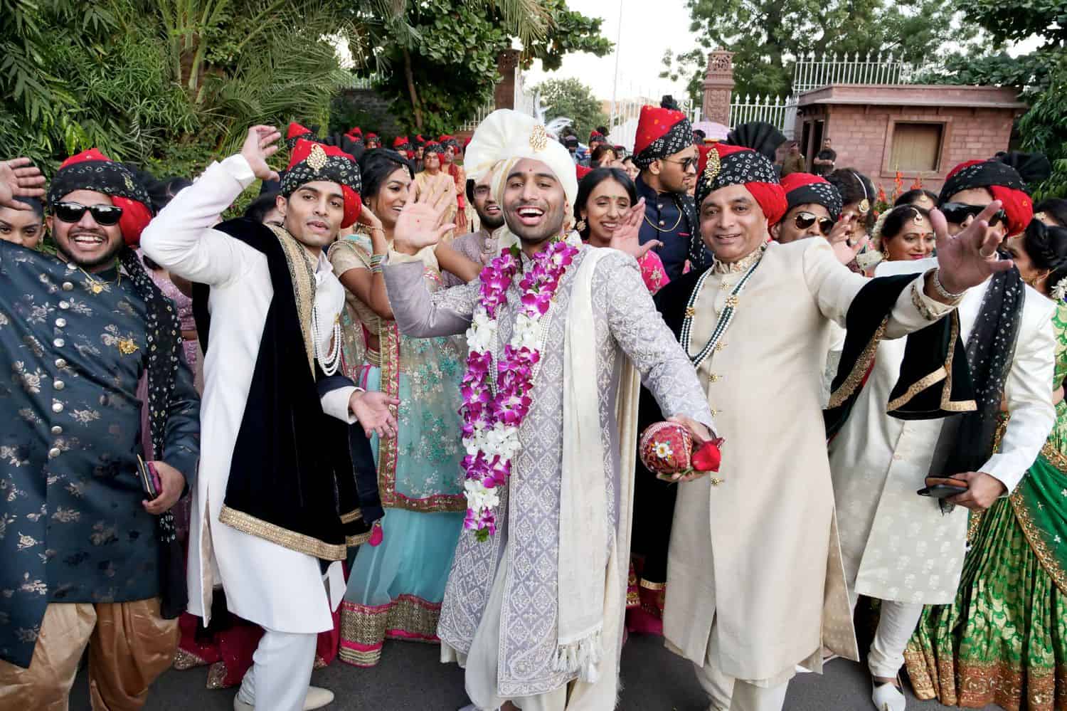 An Indian groom together with wedding guests