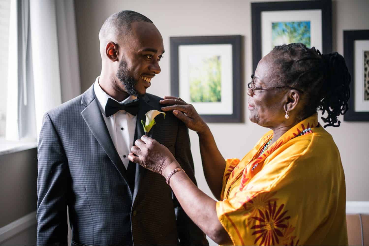 A groom with his mother before the wedding