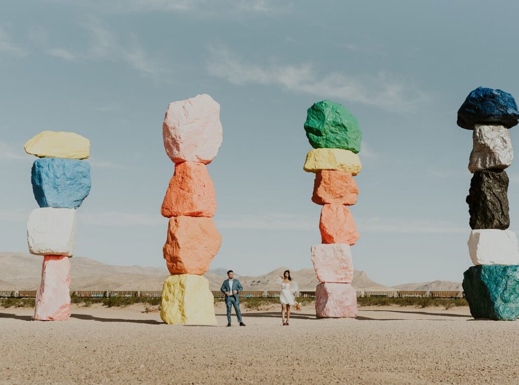 couple posing in front of rocks