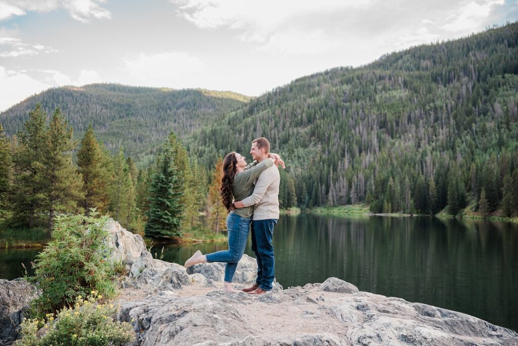 couple on rock in woods
