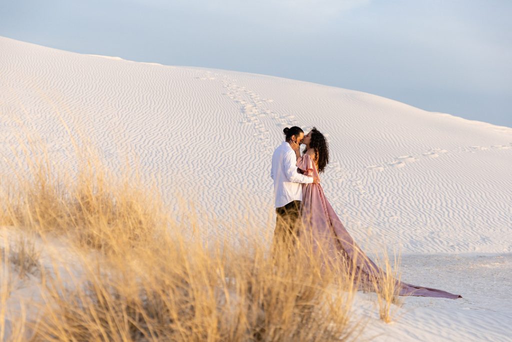 couple kissing in desert