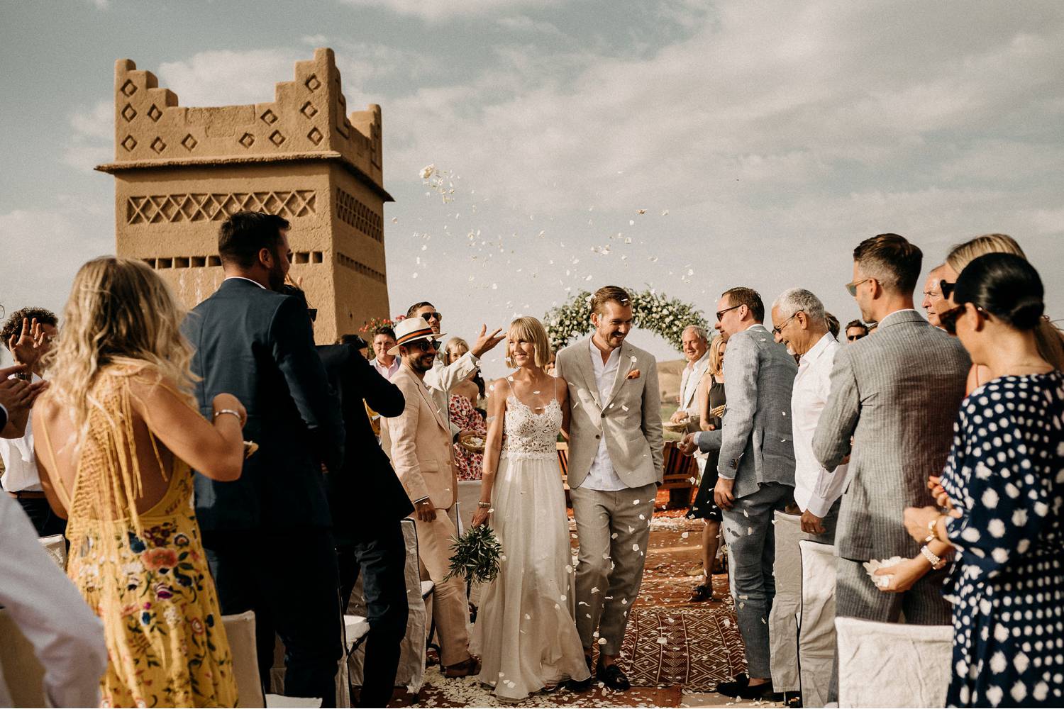 Aneta Lehotska's wedding photo depicts two newlyweds processing up the aisle as their guests shower them with flower petals.