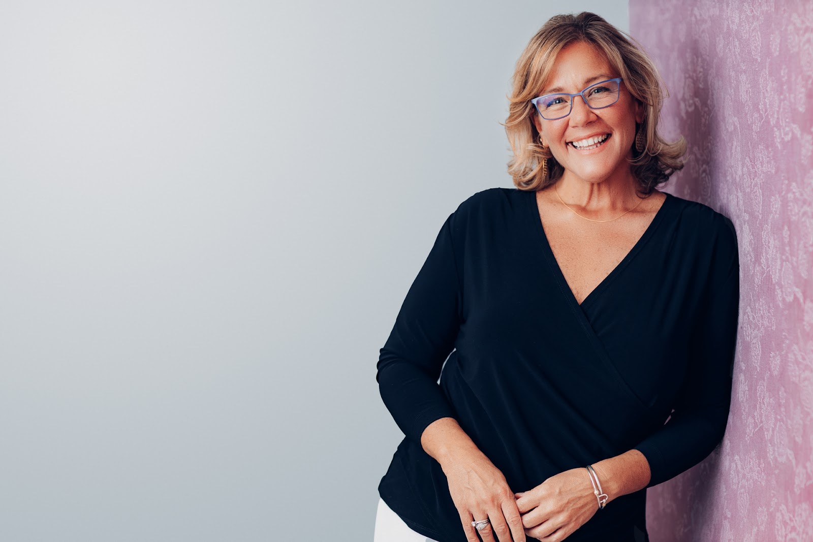 Portrait of woman with fabric backdrop
