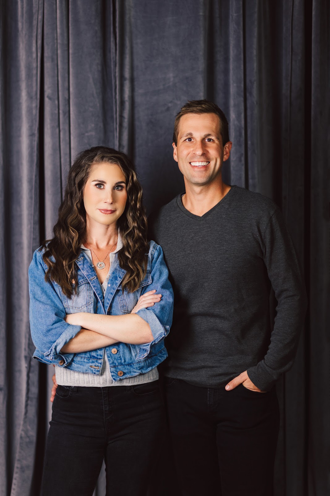 Portrait of couple with fabric backdrop