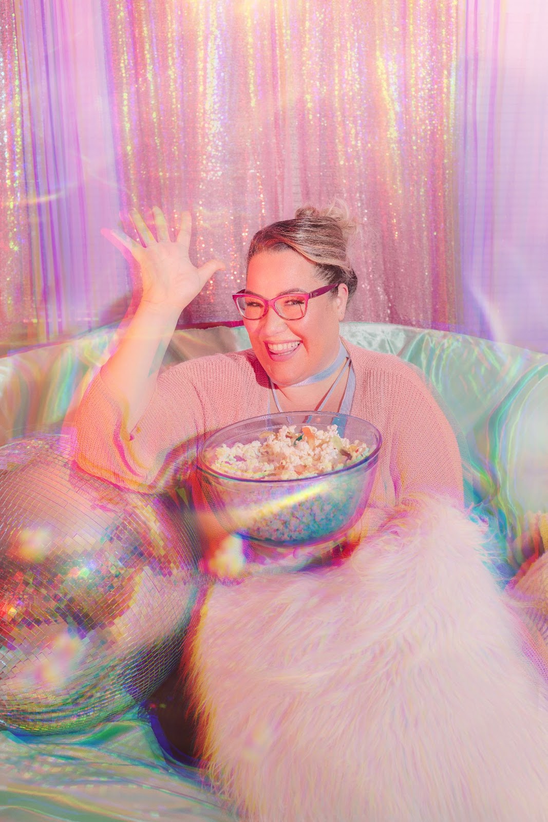 Portrait of woman with glitter curtain backdrop