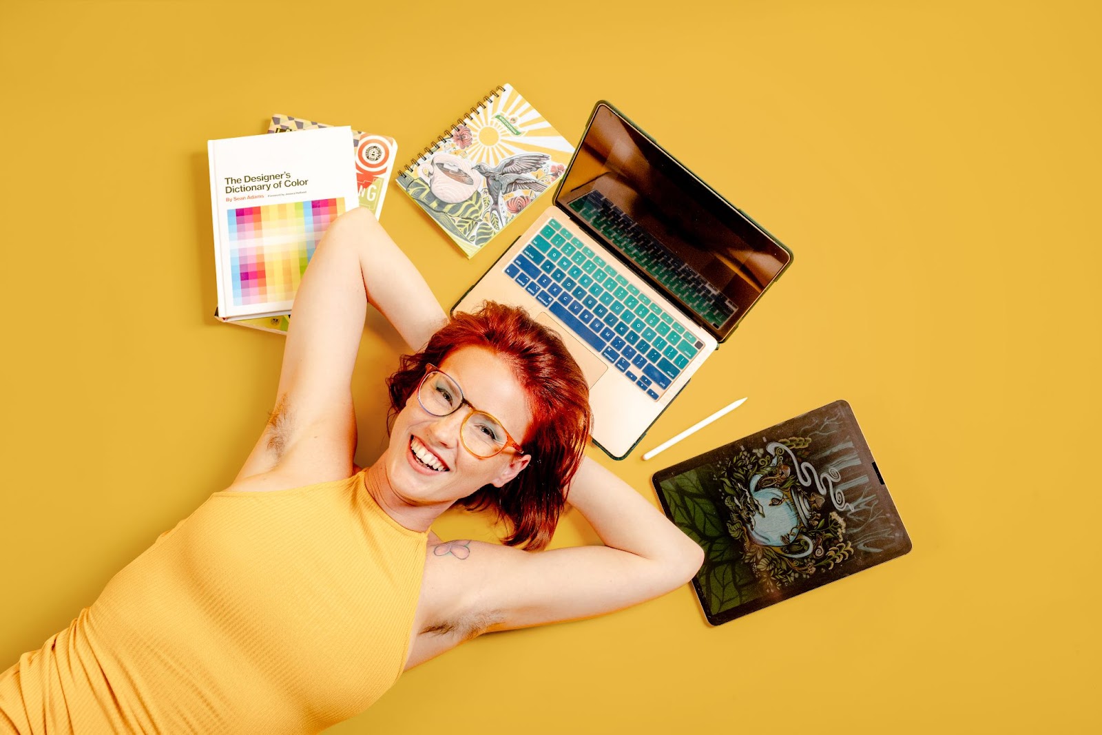 Girl with laptop and study materials