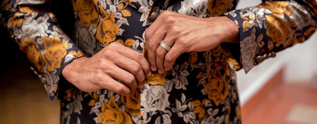 blog header shootproof hands buttoning brocade jacket