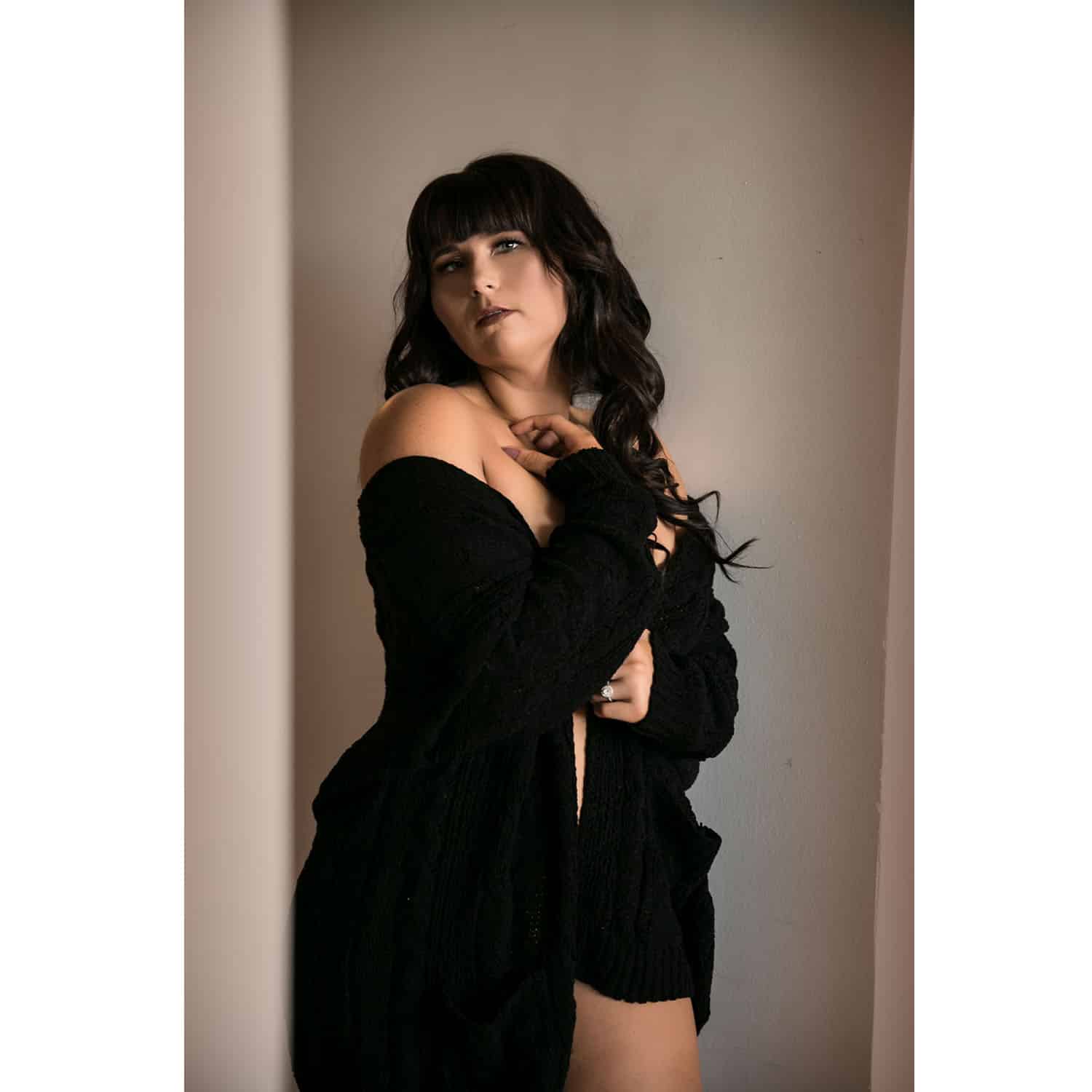 OWN Boudoir's color portrait of a woman wearing only a black sweater