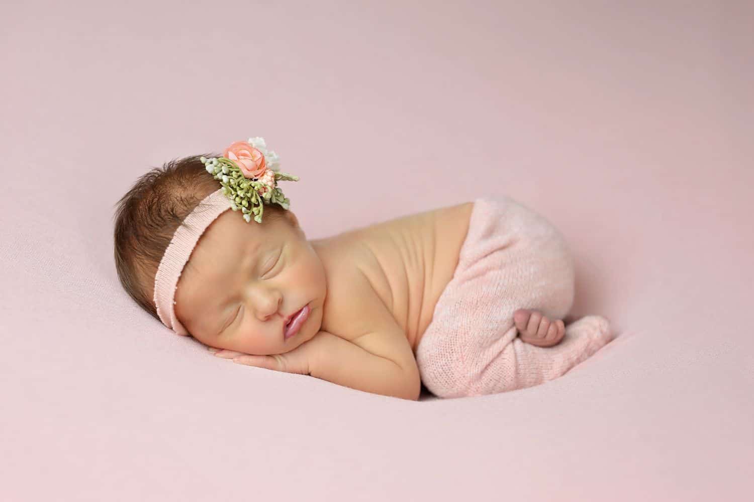 How To Attract New Clients In 3 Bold Business Moves: Newborn baby on pink blanket by Cassie Clayshulte