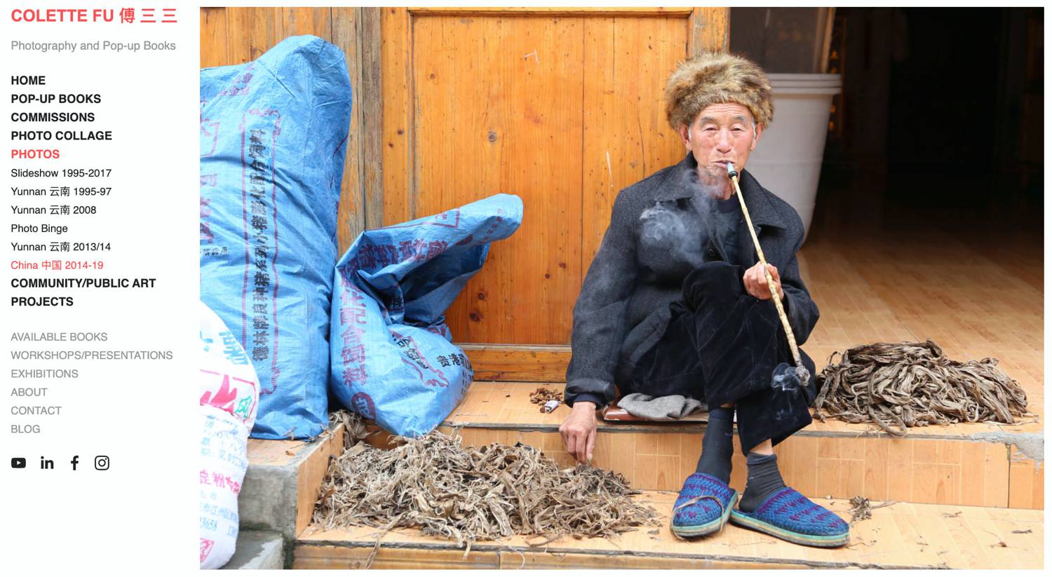 Website: Collette Fu's pop-up books and photo collages are supported by her travel imagery, like this photo of a man smoking a long pipe as his sits in the doorway of his home in China.