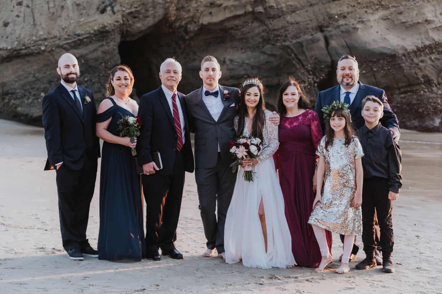 Seaside family portrait at an outdoor wedding by the cliffs