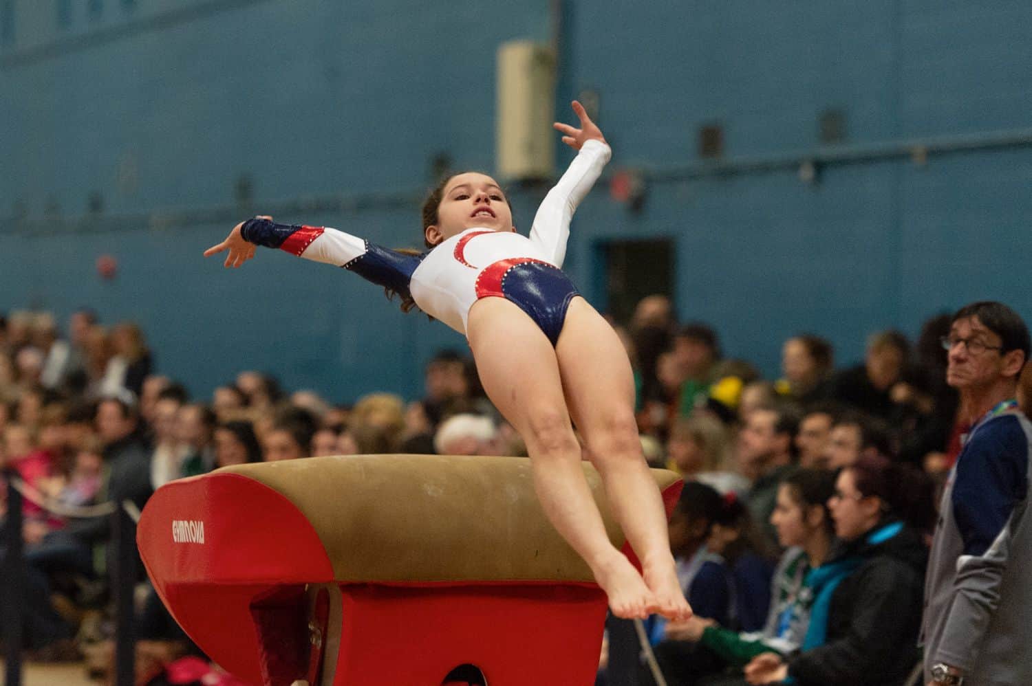 A young girl doing a gymnastics routine