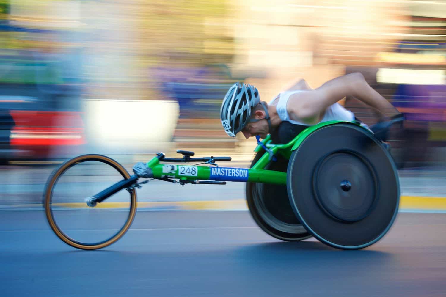 A paraplegic man joining wheelchair racing