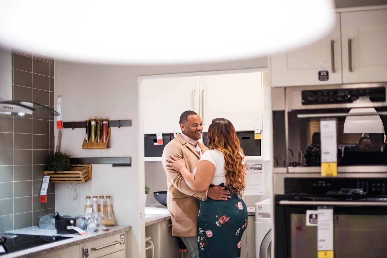 Great Engagement Sessions: Couple embraces in an IKEA kitchen.
