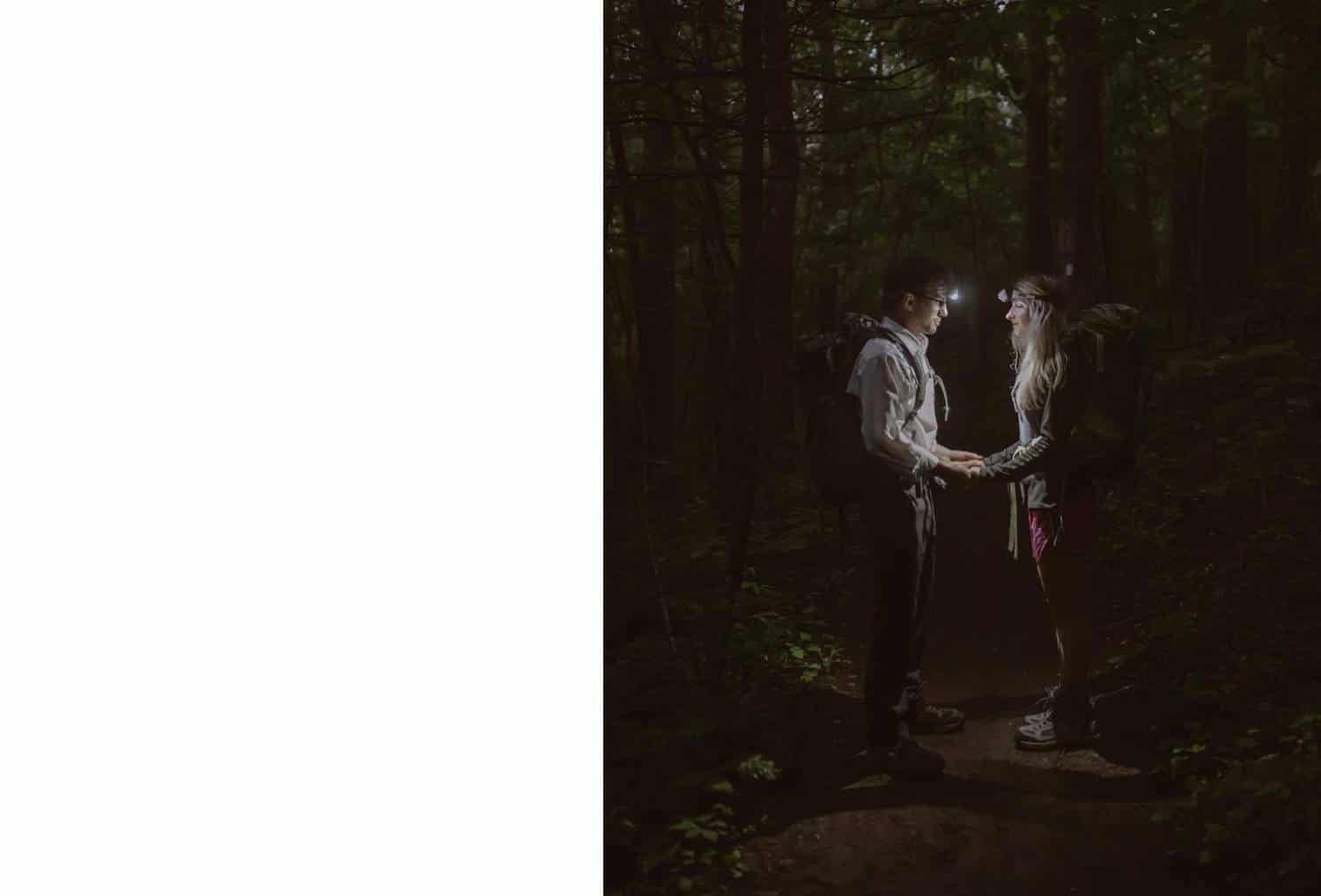 Photo: Kayla Wentzek's nighttime portrait of a couple shows them standing face-to-face in a dark forest with only their headlamps to illuminate the scene.