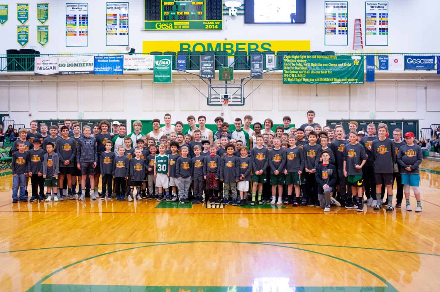A kids basketball team poses for their annual sports portrait