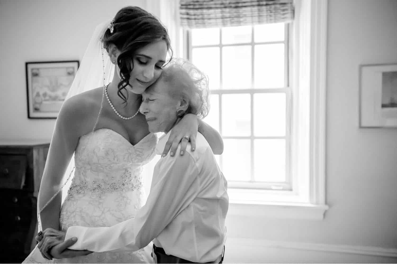Make Money with Photography: bride hugs her much smaller grandmother