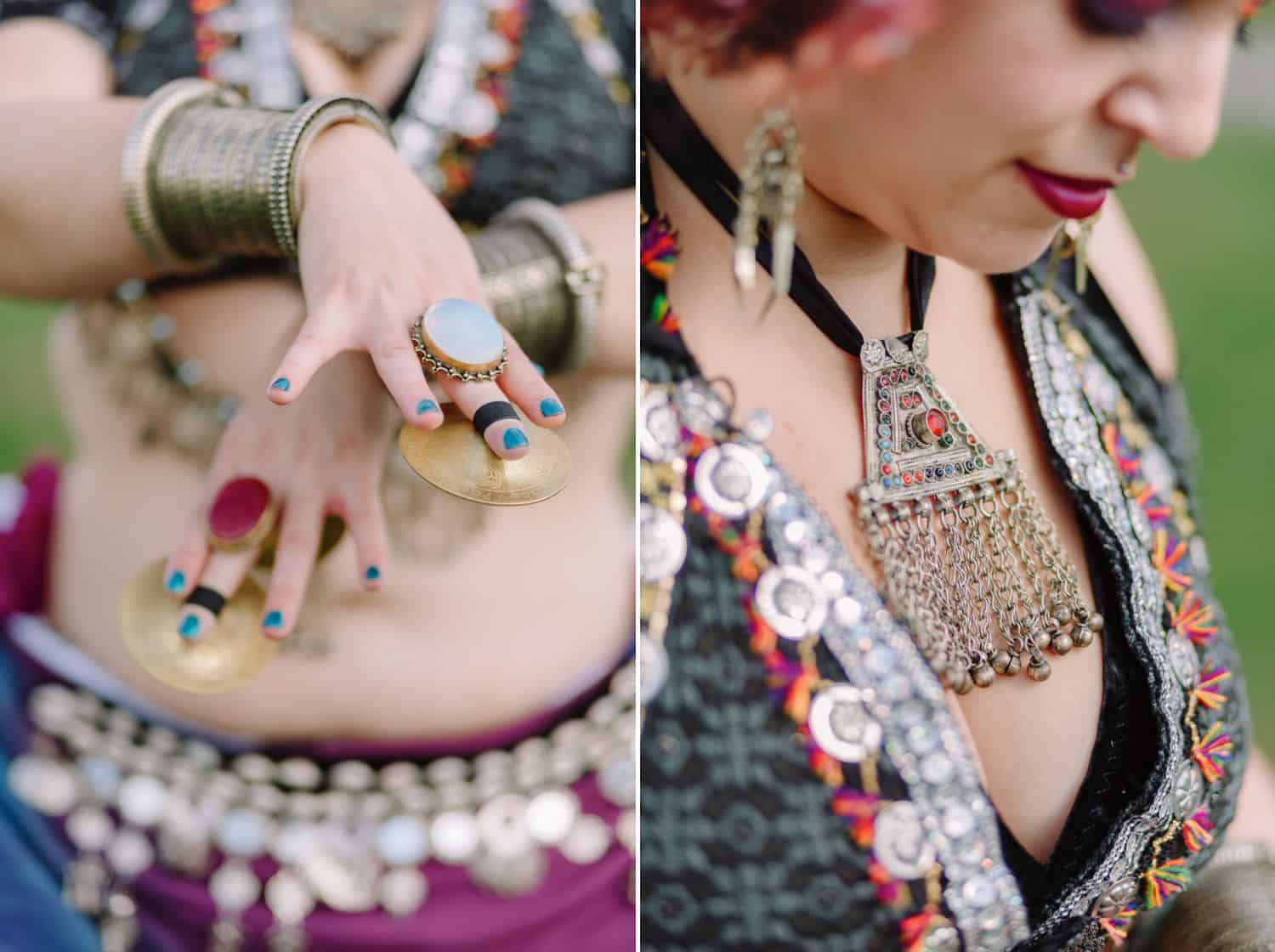 a belly dancer's hands and jewelry are depicted in close-up detail