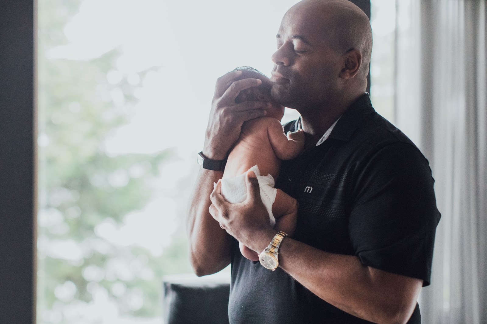 Father holding his newborn baby