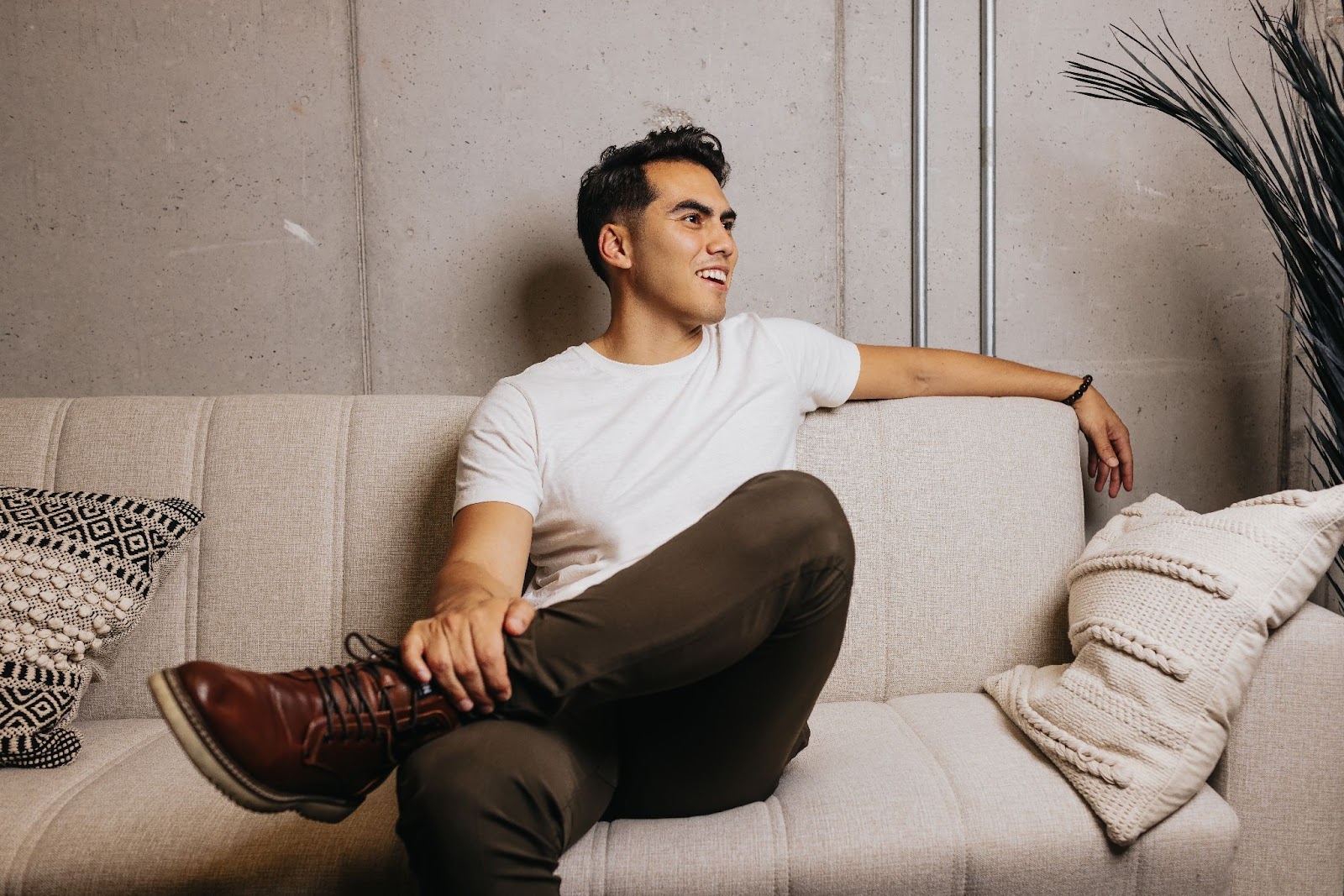 Personal branding photography of man sitting on a couch
