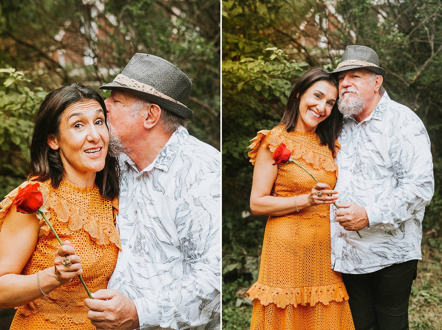 A woman in a tangerine dress snuggles close with a bearded man wearing a gray hat