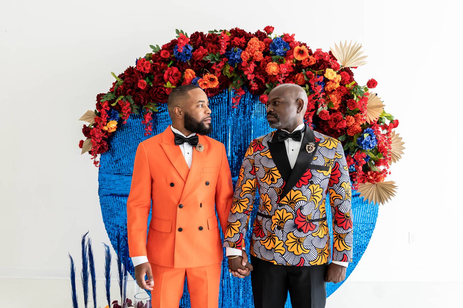 Atlanta grooms stand side-by-side in LaJoy Photography's daylight studio and pose for wedding portraits
