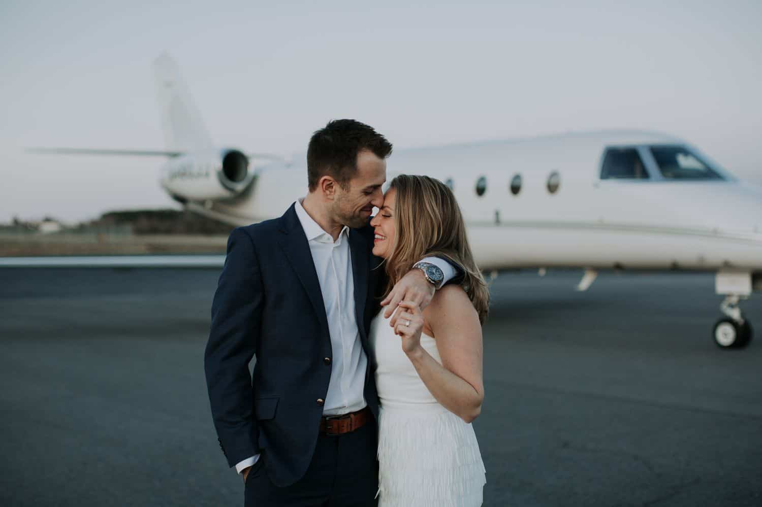 A photo of a couple taken at an airport