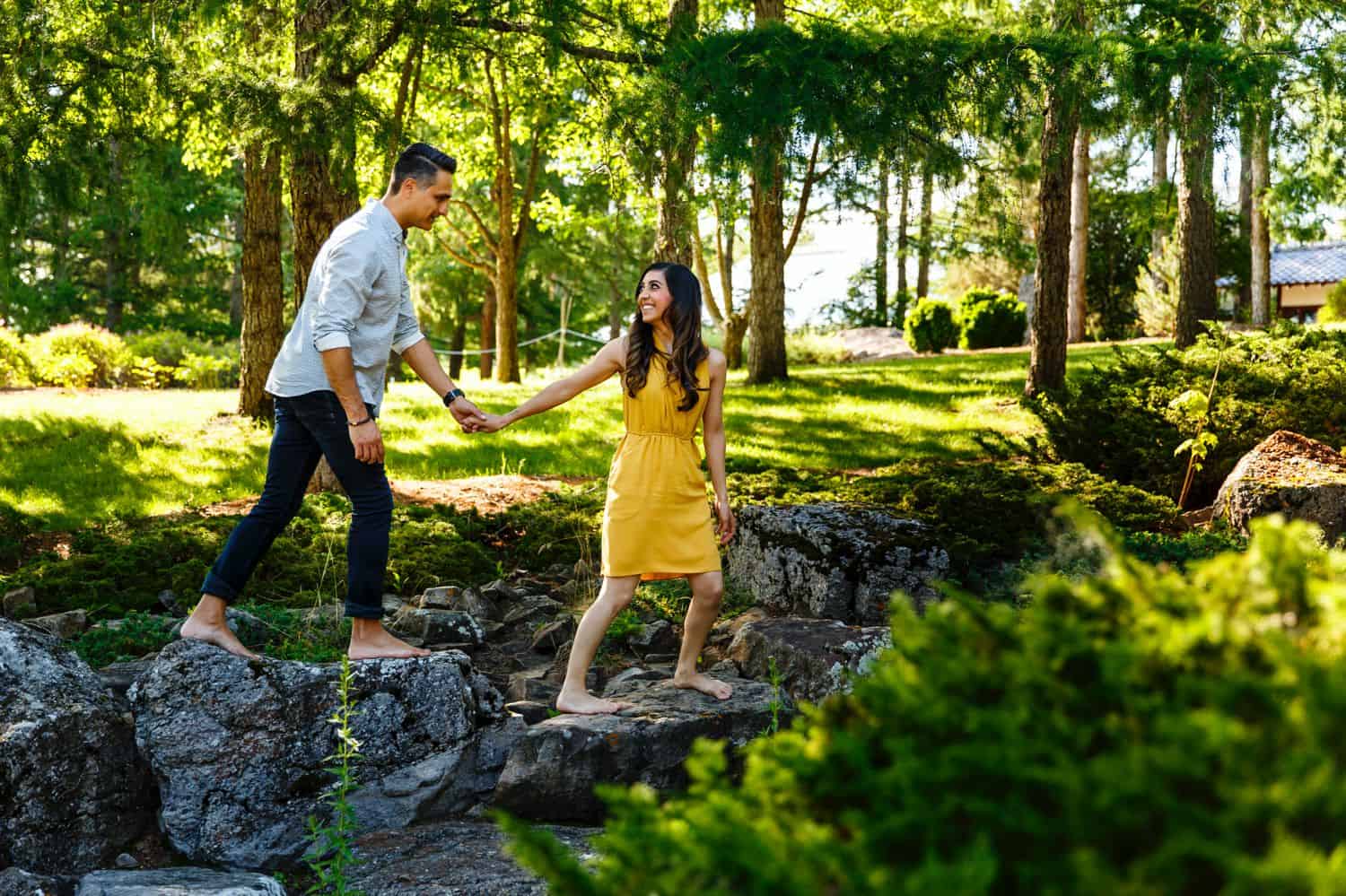 A couple crossing the stream together
