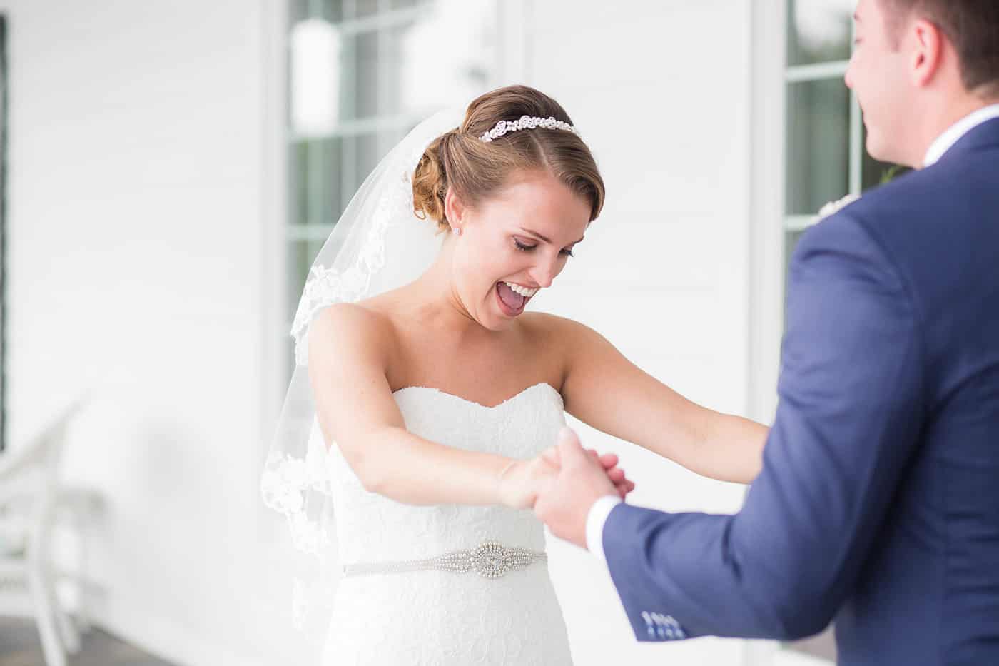 happy bride during first look by customer service whiz cinnamon wolfe