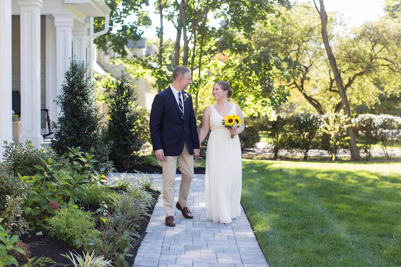 bride with sunflower bouquet walking down the aisle by customer service whiz cinnamon wolfe