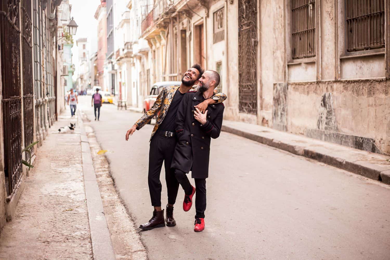 Skyrocket Your ShootProof Sales With One Easy App: Engaged couple walks through Havana streets laughing.