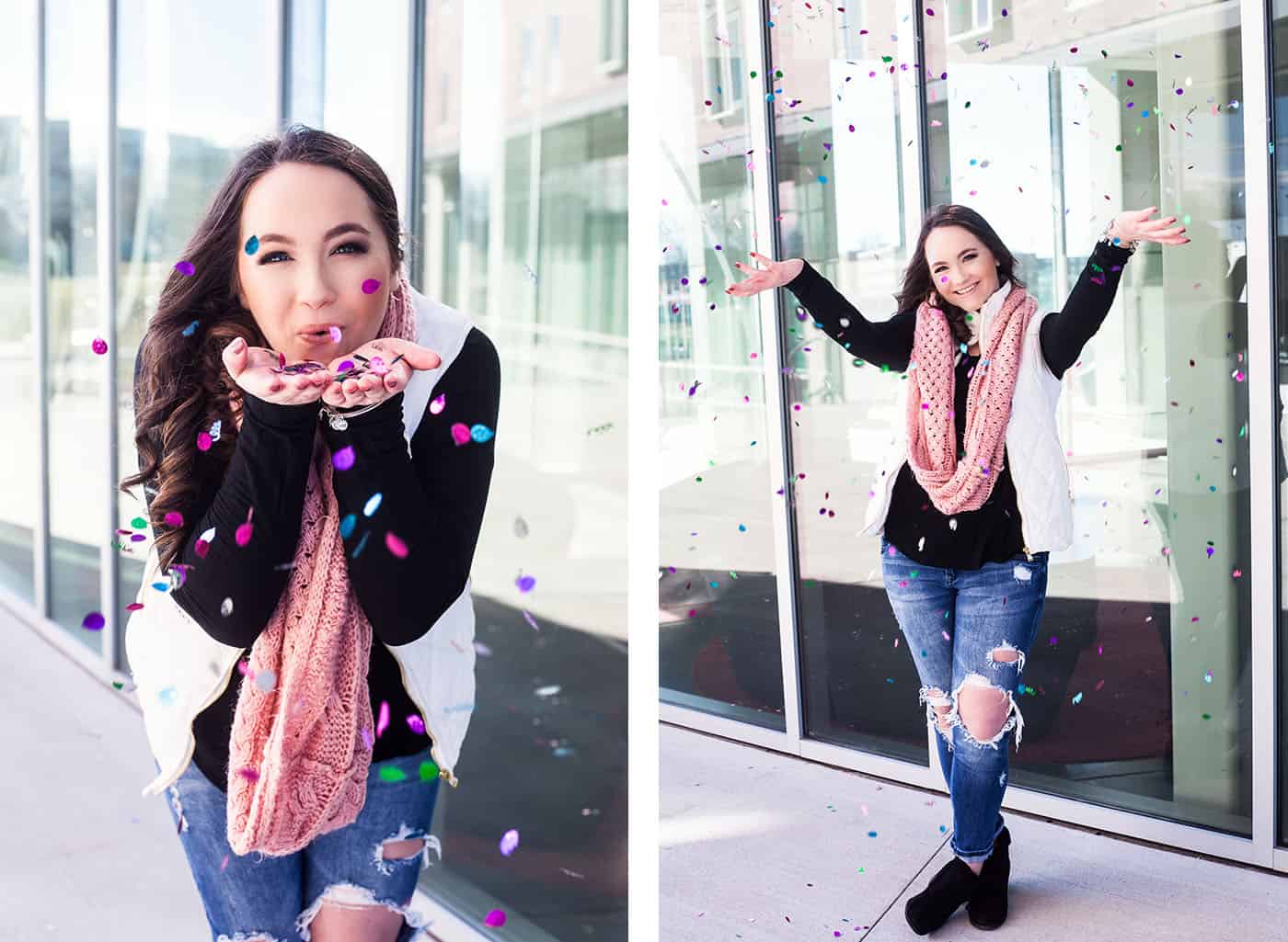 senior girl tossing confetti by reflective glass