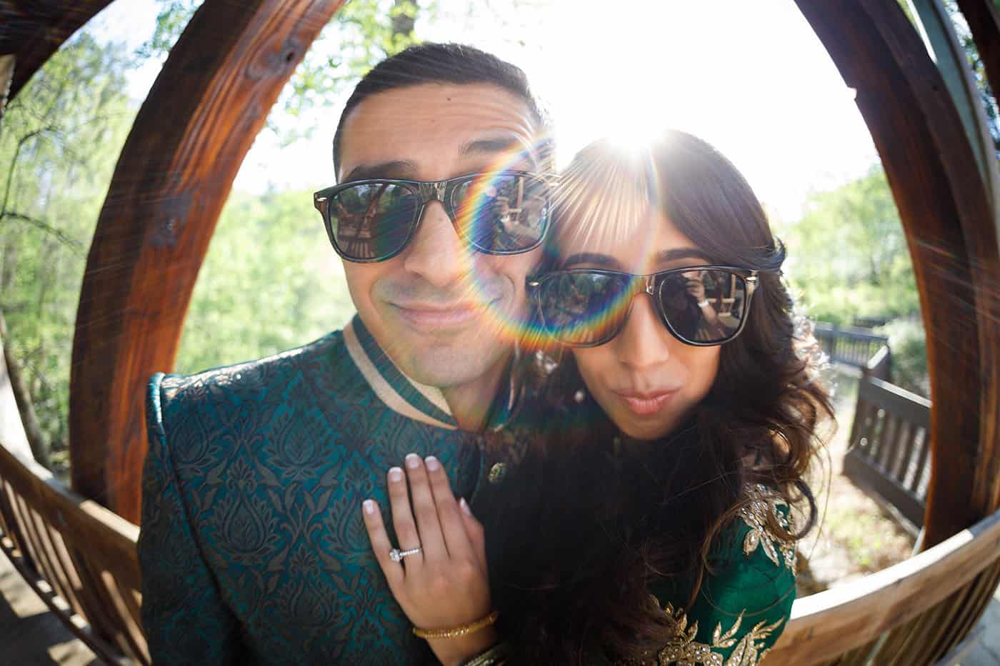 This is the Key to Amazing Client Relationships | An Indian couple pose for a fisheye portrait in their sunglasses.