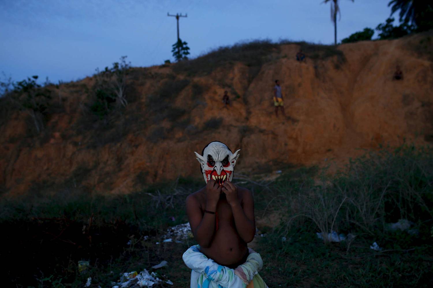 Photo: Stephanie Foden's dusk portrait of a young man wearing a devil mask.