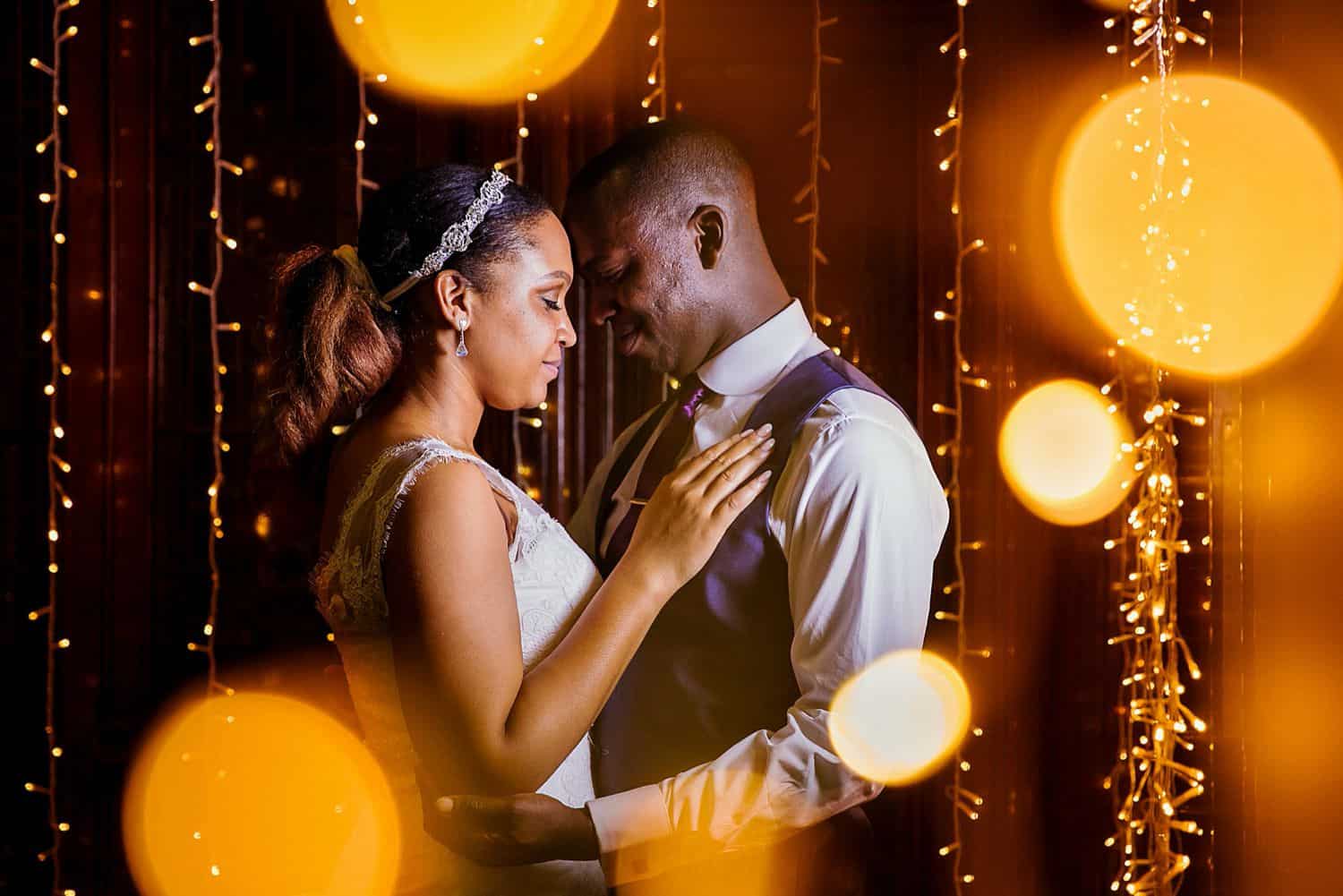 A bride and groom slow dance to their first song as husband and wife